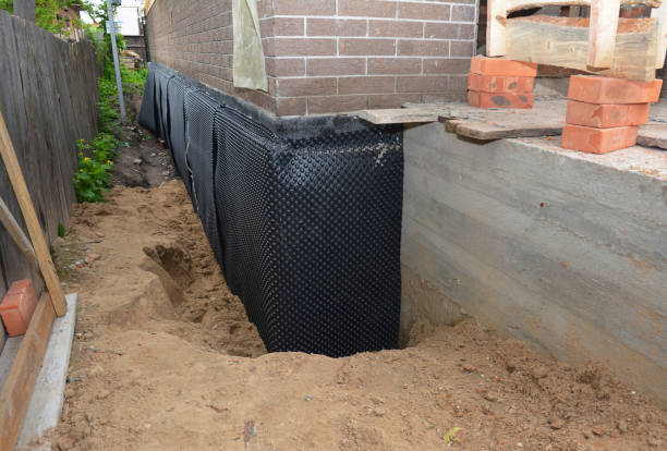 Happy homeowners after waterproofing job in Potter